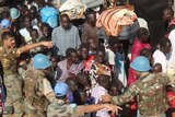 Civilians gather outside the UN compound in Juba