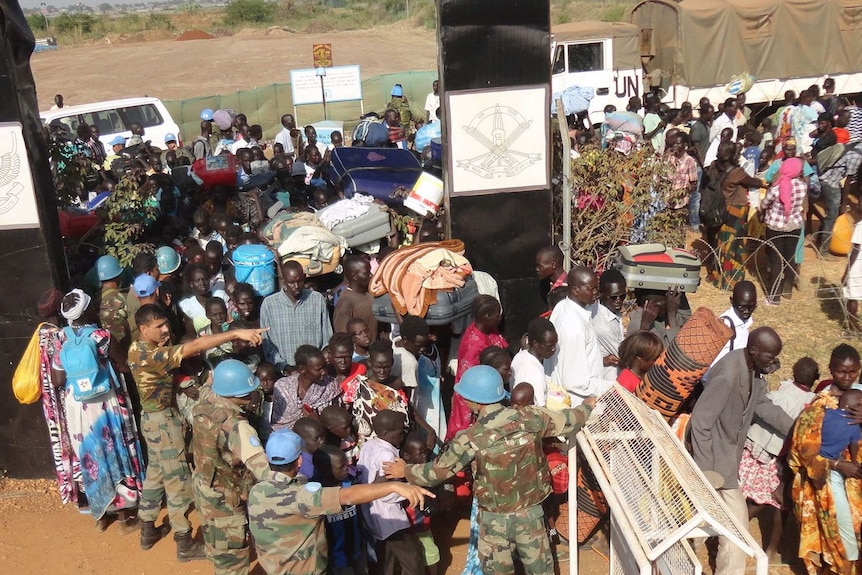 South Sudanese civilians gather outside the UN compound in Juba