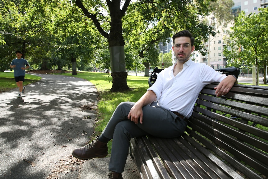 A man sitting on a park bench
