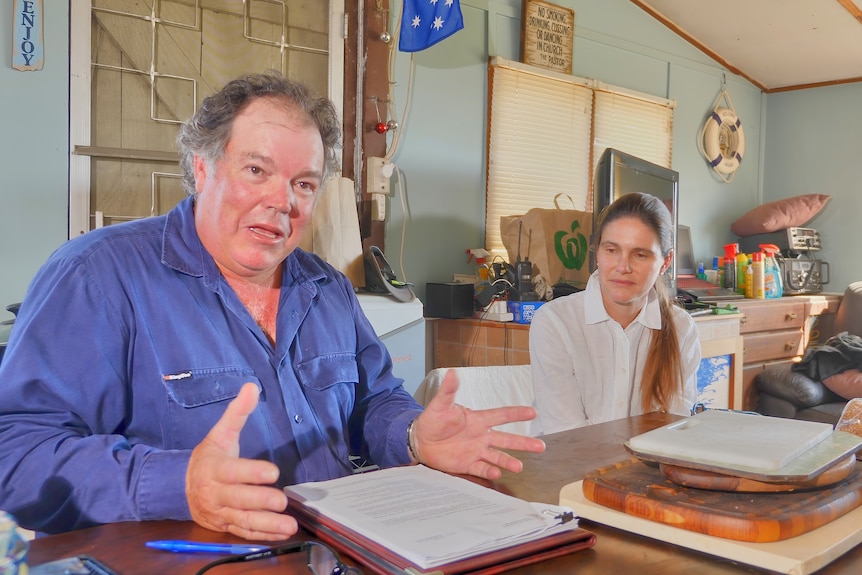 Picture of Mike and Maria at the kitchen table of their shack