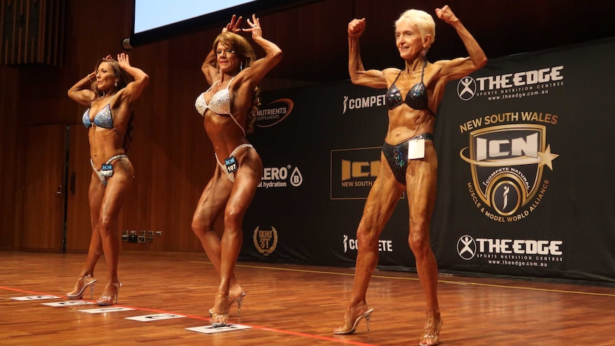 Janice Lorraine, right, strikes a pose on stage in the 50-plus category.