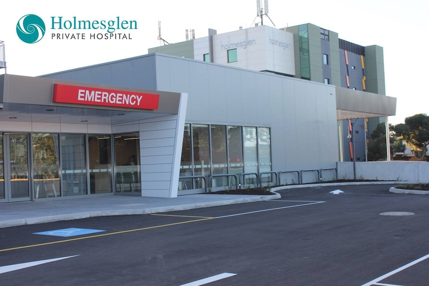 Photo taken of emergency entrance to the hospital from an empty carpark