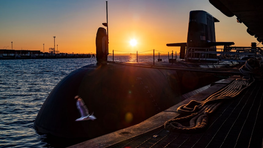 A Royal Australian Navy submarine in the dawn light