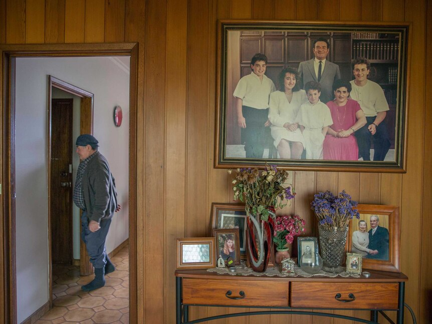 Rita and Tony Faranda's family portrait at the entrance to their home