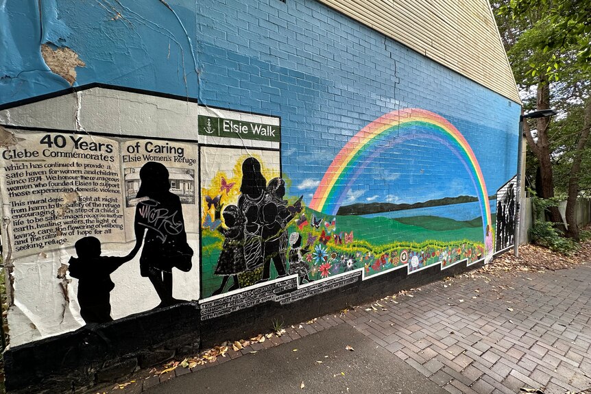 Mural of a woman and children with a rainbow