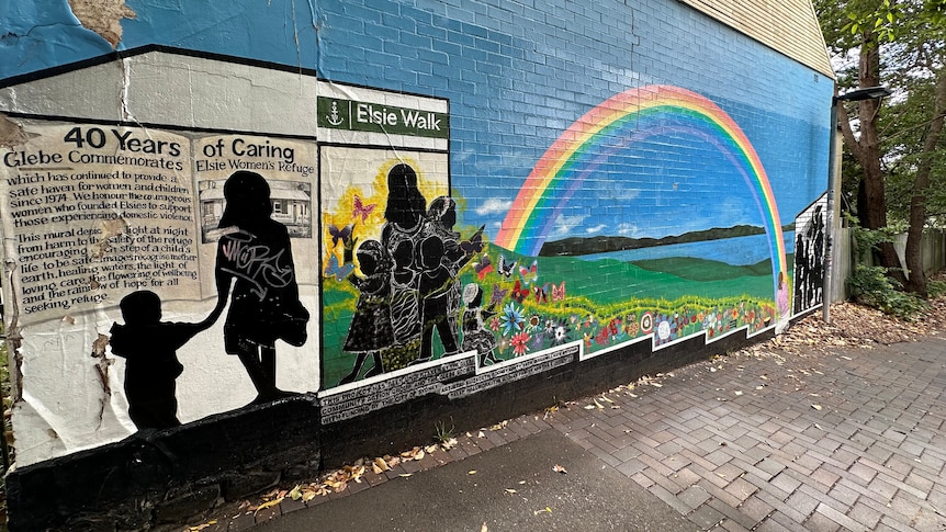 Mural of a woman and children with a rainbow