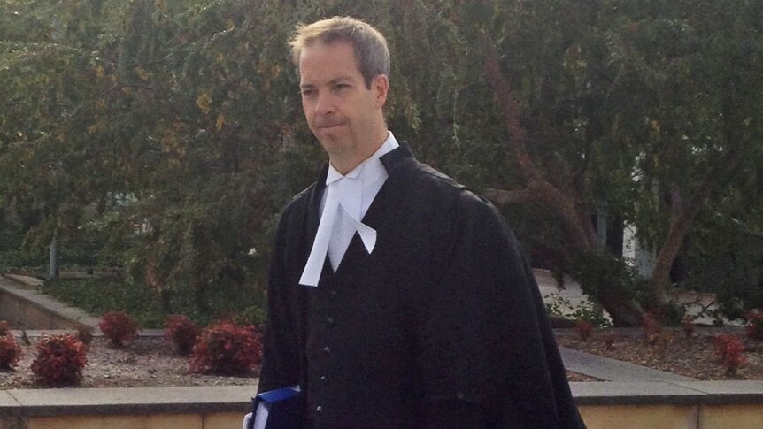 Peter Slipper's defence lawyer Marcus Hassall entering the ACT Supreme Court.
