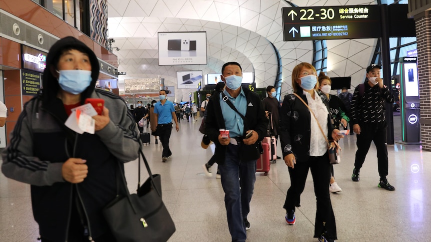 People walking inside the airport.