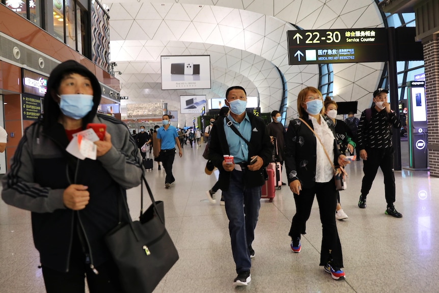 People walking inside the airport.