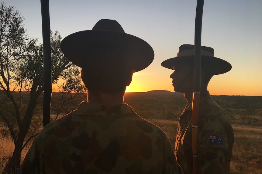Norforce recruits Seth Lawlor and Siberia McDonald hold their spears at Halls Creek.