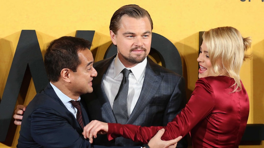 Riza Aziz frolics with Leonardo DiCaprio and Margot Robbie on the red carpet.