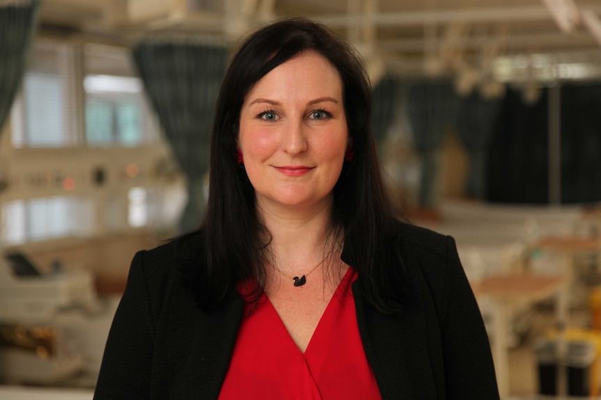 Lara Hatchuel looks at the camera inside a medical ward where they are conducting a trial.