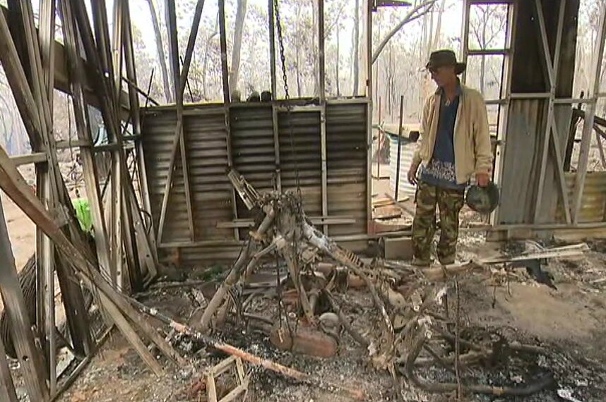 Ron Heperi inspects bushfire damage
