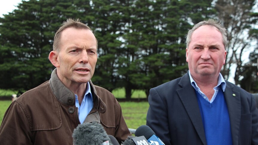 Prime Minister Tony Abbott and Agriculture Minister Barnaby Joyce on a dairy farm