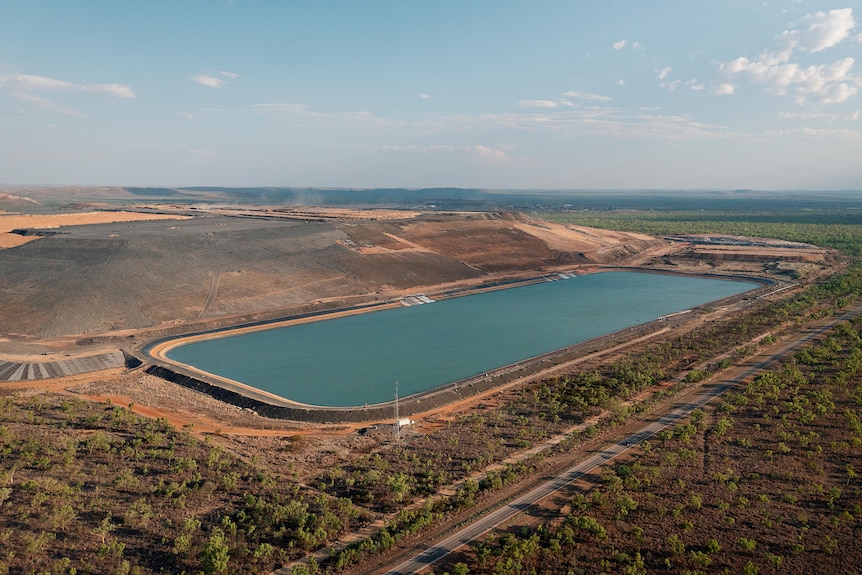 An aerial image of the waste rock dump -a large rectangle body of water - at the McArthur River Mine. 