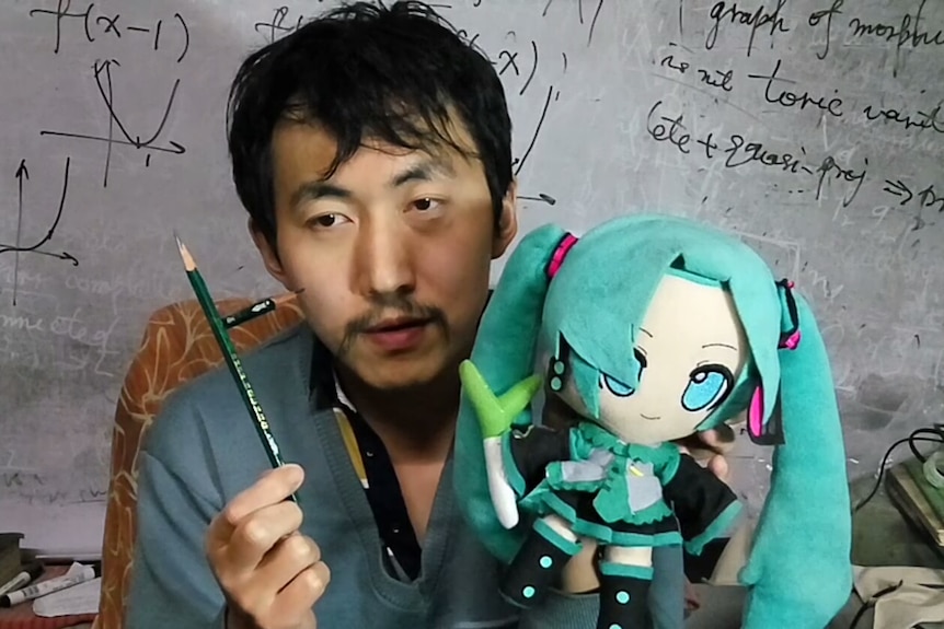 A Chinese Social influencer, known by the nickname Professor Strongart seen in front of a whiteboard