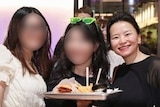 A screenshot of a post on WeChat shows three women, two have their faces blurred, posing for a photo and holding up a burger.