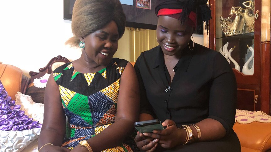 Awer Mabil's mother and sister watch replay of his debut Socceroos goal