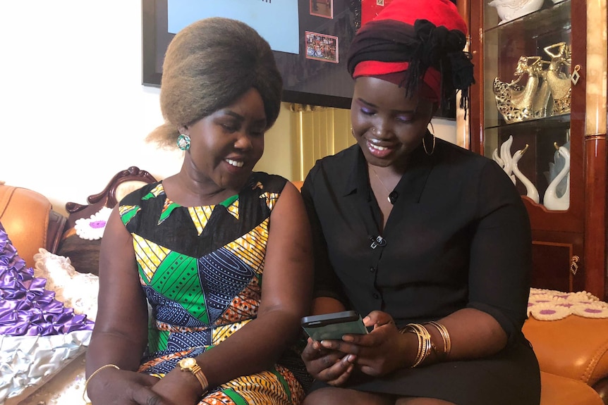 Awer Mabil's mother and sister watch replay of his debut Socceroos goal