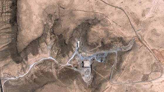 Satellite images, taken August 5, 2007 (Top) and October 24, 2007 (Bottom), show a suspected nuclear