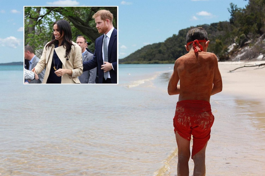 Boy stand on beach facing away from camera with image of Prince Harry and Meghan Markle embeded in corner.