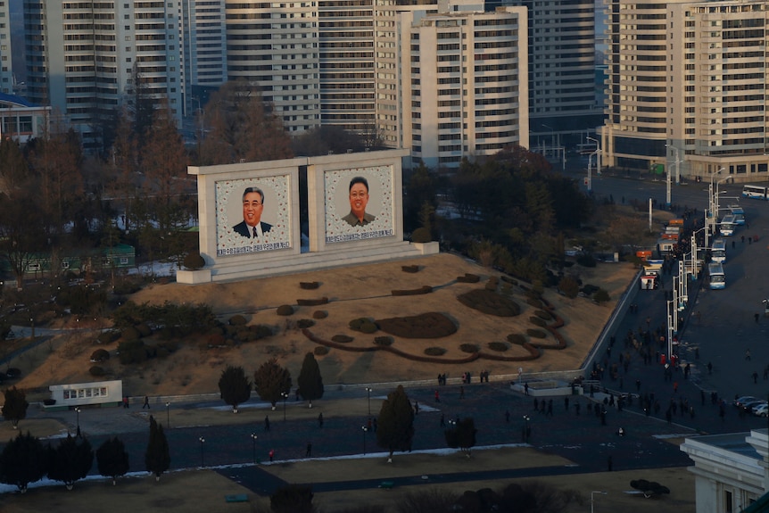 Portraits of late North Korean leaders Kim Il Sung and Kim Jong Il sit in downtown Pyongyang.