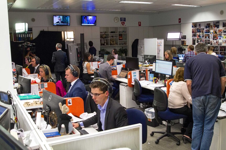 ABC journalists in the newsroom