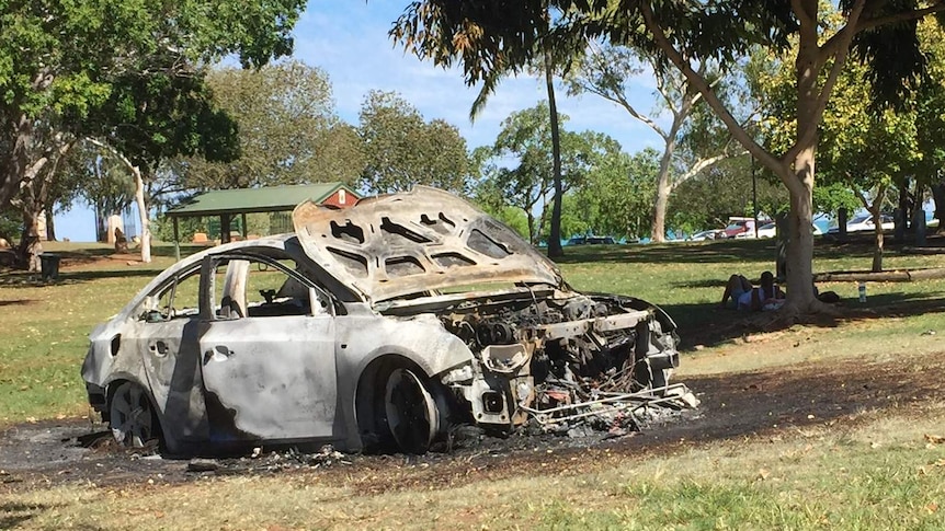 A burnt car in a Broome park.