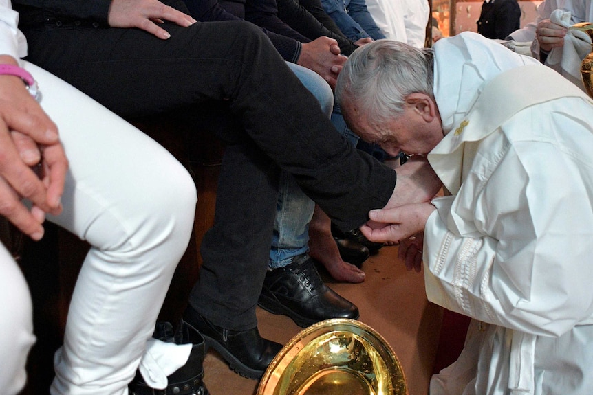 Pope Francis washes the feet of some inmates at the Paliano prison
