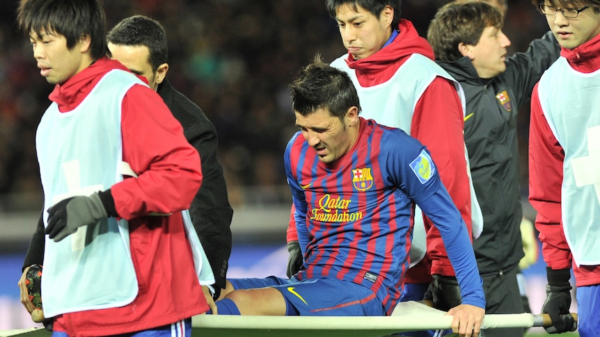 Barcelona striker David Villa stretchered off the field