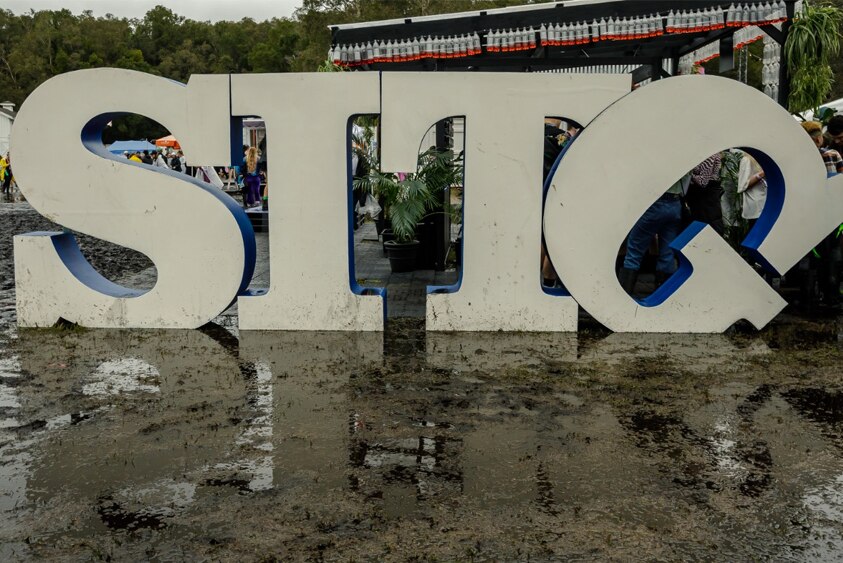 A lopsided SITG logo in the mud at Splendor In The Grass.