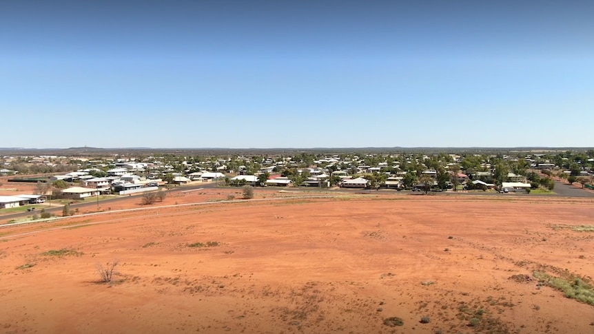 Aerial shot of small town with red dirt