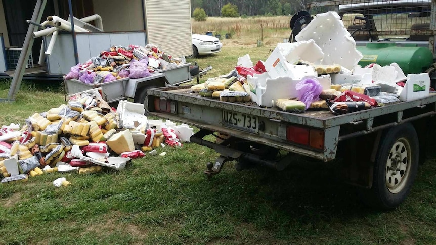 A trailer is filled with groceries from the river