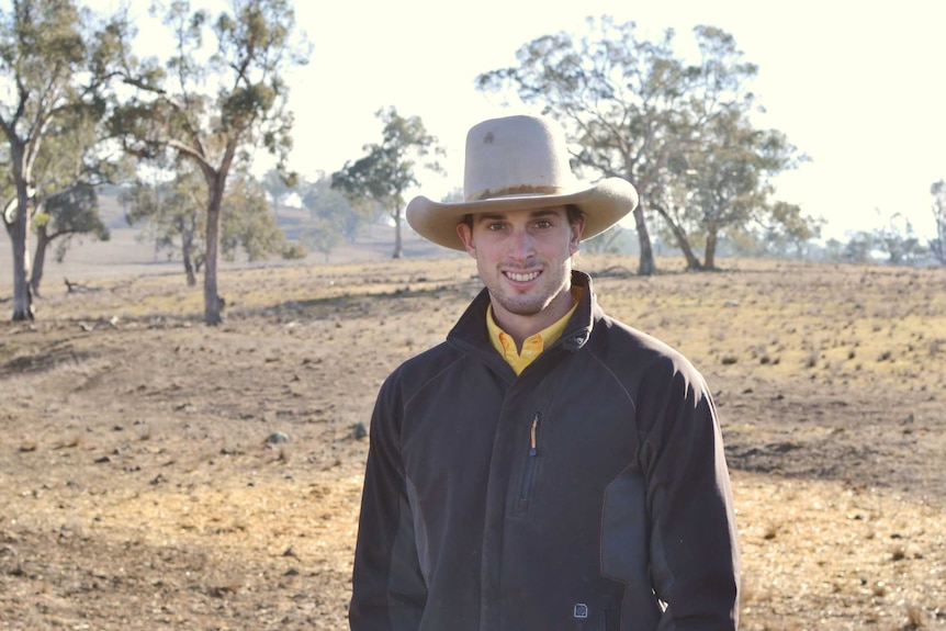 A man smiles at the camera.