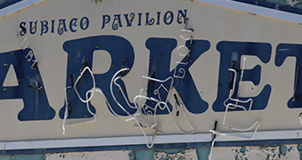 The Subiaco Pavilion Markets sign showing neon lighting hanging off it.