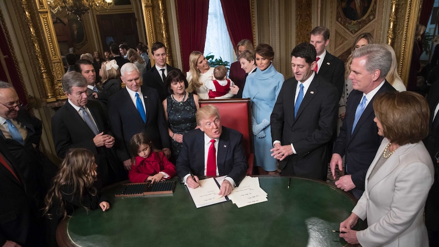 President Donald Trump formally signs his cabinet nominations into law