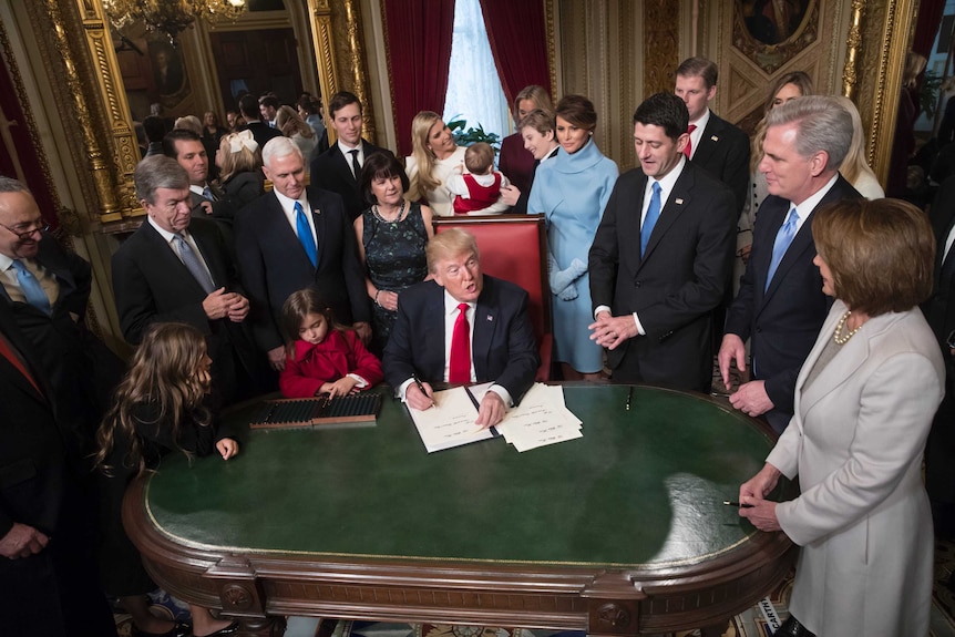 President Donald Trump formally signs his cabinet nominations into law