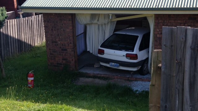 The mother and her two young children leapt from the moving car before it smashed into the unit.