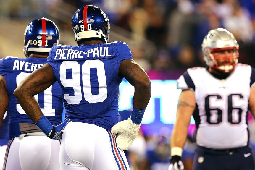 Jason Pierre-Paul plays with his bandaged hand
