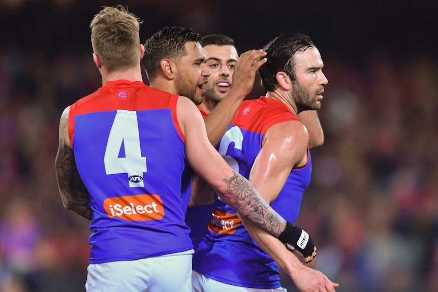 Jordan Lewis and Melbourne Demons teammates celebrate a goal against the Adelaide Crows.