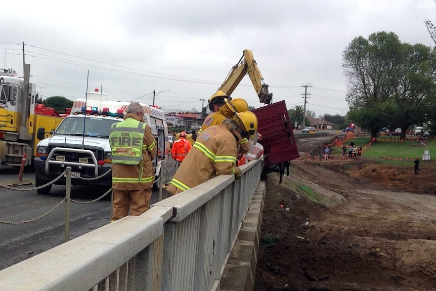 Truck dangles over bridge at Winchelsea after crash