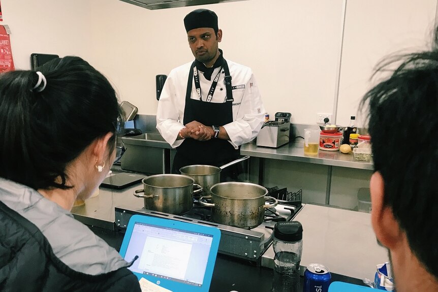 Narendra Joshi working in a commercial kitchen.