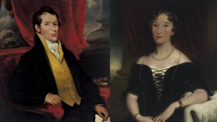 Photo of two paintings of a man and a woman.