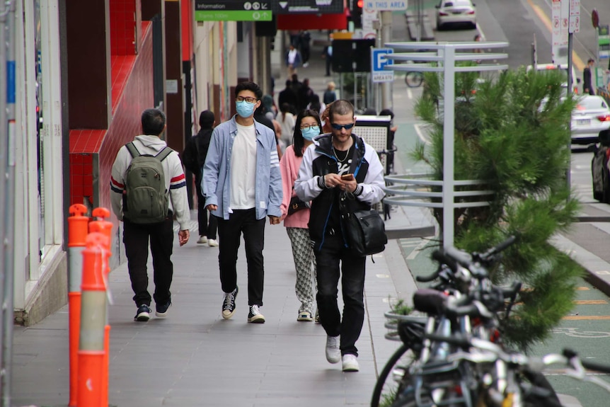 A photo of people walking in a street in Melbourne's CBD.