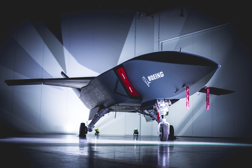 Boeing Loyal Wingman plane in hangar. 