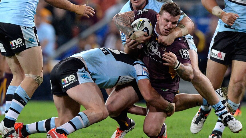 The Broncos' Josh McGuire is tackled during Brisbane's round 18 game with Cronulla at Lang Park.
