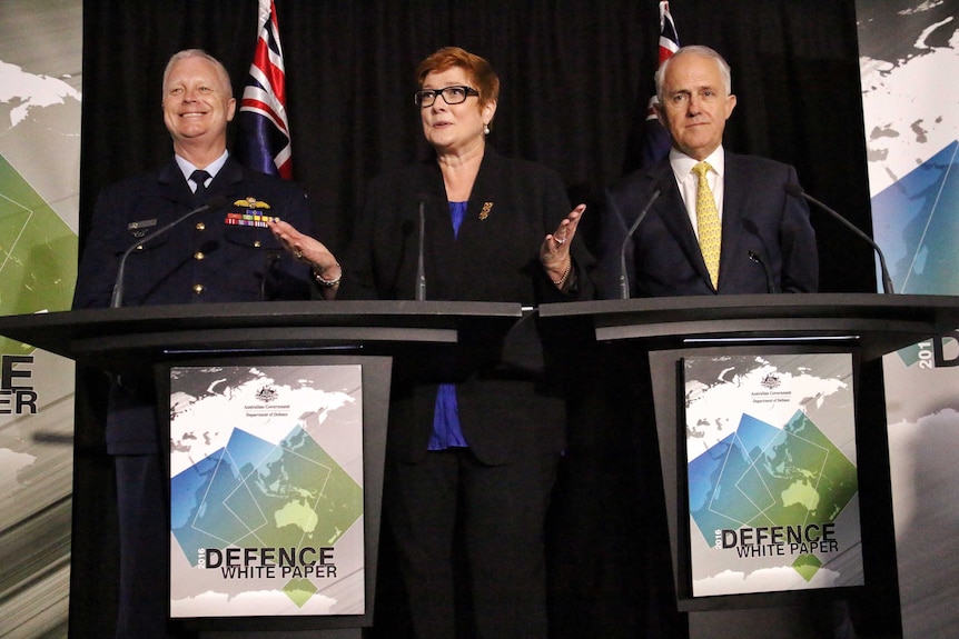 Mark Biskin, Marissa Payne and Malcolm Turnbull speak at a podium.