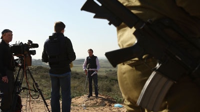 File photo: Journalist reporting on the Gaza border (Getty Images: Spencer Platt)