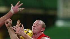 Barry Hall contests a mark for the Swans