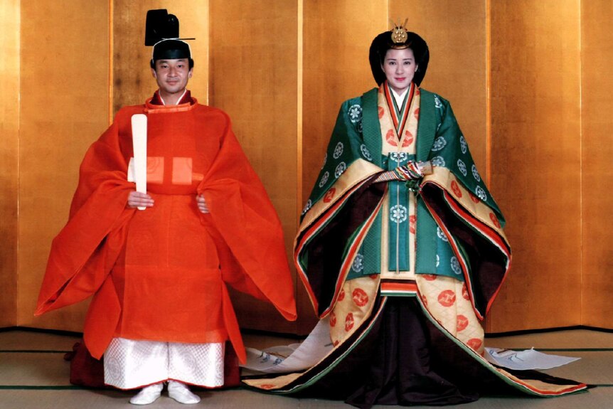 Crown Prince Naruhito and Masako pose for a photo in traditional Japanese dress